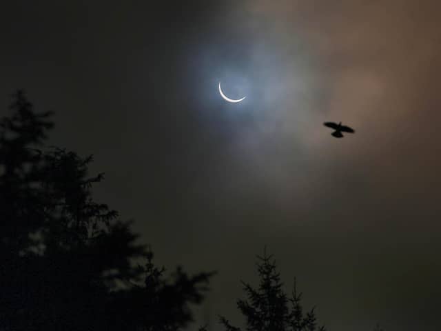 View of a solar eclipse from Killylane Reservoir, Larne, in 2015.