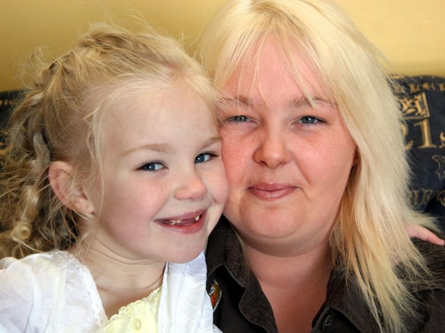 Megan smiles for the camera with her Mum Martina on the occasion of her 7th birthday at home.0011JML : Parties in Derry in Spring 2006.