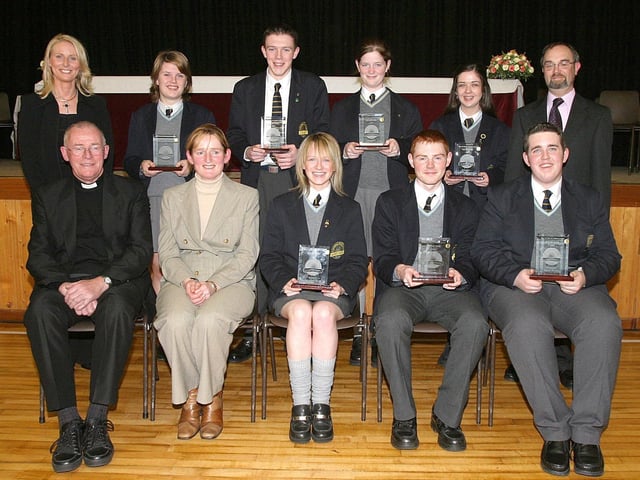 Students who were placed in Northern Ireland in Irish with their awards at Lumen Christi College annual Prizegiving ceremony. Included (from left) are Monsignor Ignatius McQuillan, Pauline Casey, chairman of the College Board of Governors, Triona Doherty, Patrick Graham and Simon Doolin. Standing are Bronach O'Hare, Head of the Irish Department, Caitlin Morrison, Conor Darrall, Maria Cutliffe, Mairead McGilloway and College principal Patrick O'Doherty. (1411T02). :Lumen Christi College prizegiving ceremony in 2003