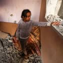 A girl reacts standing in a house destroyed by Israeli bombardment in Rafah refugee camp, south of the Gaza Strip, on January 1, 2024, amid the ongoing conflict between Israel and the Palestinian militant group Hamas. (Photo by AFP) (Photo by -/AFP via Getty Images)