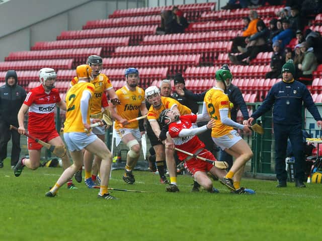 Derry’s Eamon Cassidy is brought to ground by Antrim players during the Ulster U20 Hurling Cup Final at Owenbeg on Saturday. Photo: George Sweeney. DER2310GS – 118