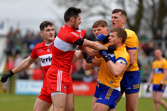 Derry’s Padraig McGrogan and Chrisse McKaigue scuffle with Clare players during Sunday’s game in Owenbeg. Photo: George Sweeney. DER2312GS – 07 