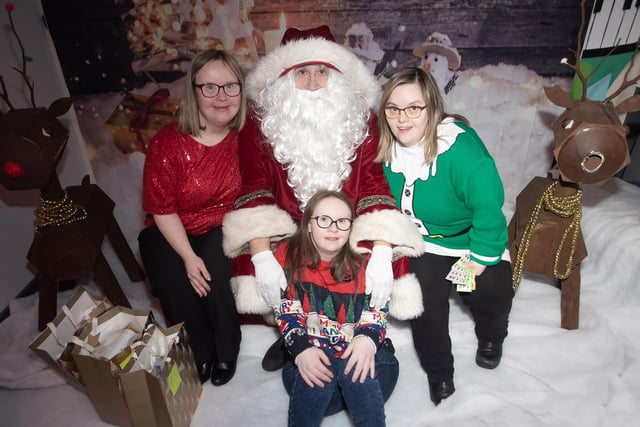 GIRLS ALOUD!. . . . .Laura, Kathy and Lisa strike up a pose for Santa Claus.