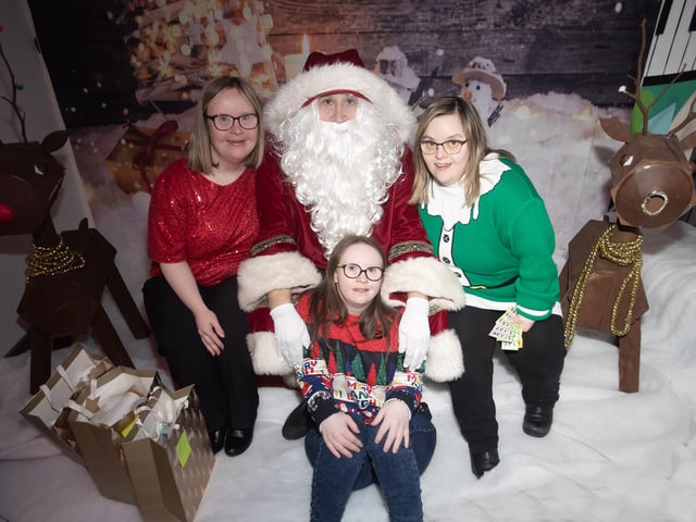 GIRLS ALOUD!. . . . .Laura, Kathy and Lisa strike up a pose for Santa Claus.