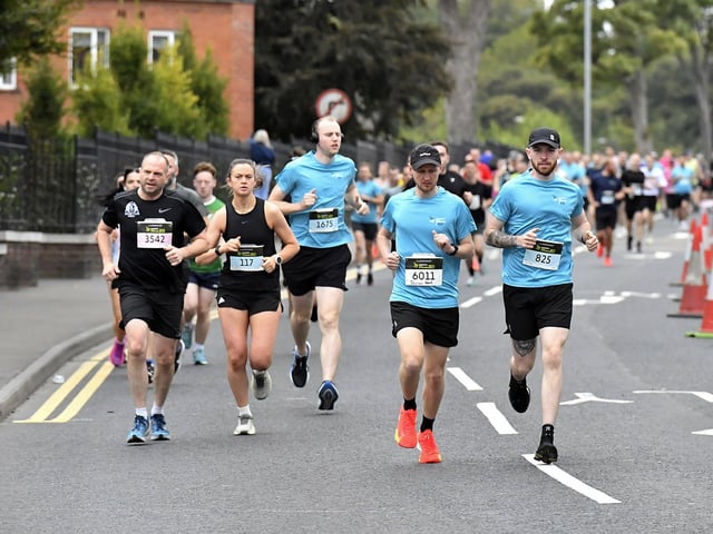 Second Wave runners in the Waterside Half Marathon make their way along Limavady Road. Photo: George Sweeney