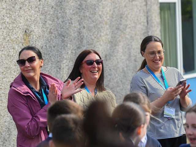 Teachers at Rosemount Primary School enjoy the music and song of the Jive Aces on Thursday morning. Photo: George Sweeney