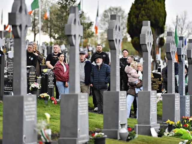 People stand alongside the Republican Plot, in the City Cemetery, during the commemoration of the 109th anniversary of the Easter Rising on Sunday afternoon. Photo: George Sweeney