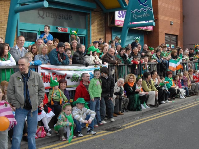 Both the streets and the kerbs were lined with people cheering on the parade in Derry on St Patrick's Day. 1703Ap14