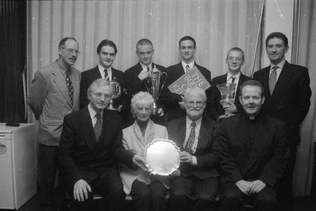 Mr. Sean McGinty, vice-president seated left, at the St. Columb's College prize-giving, presenting the Frank McAuley Prize for History to Mrs. May and Mr. John, who received the award posthumously for their son Daniel Boyle. Included at front is Fr. Eamon Martin, Head of Religious Education. Back, from left, are Mr. John McCafferty, Head of Lower School, Philip McLaughlin (Fr. McElhinney Award for Geography), Conor Costello (Classical Studies Prize), Dermot Rainey (Bishop's Prize for Religious Studies), Sean McGonagle (McCarroll Prize for English) and Mr. Robert McKimm, Board of Governors).