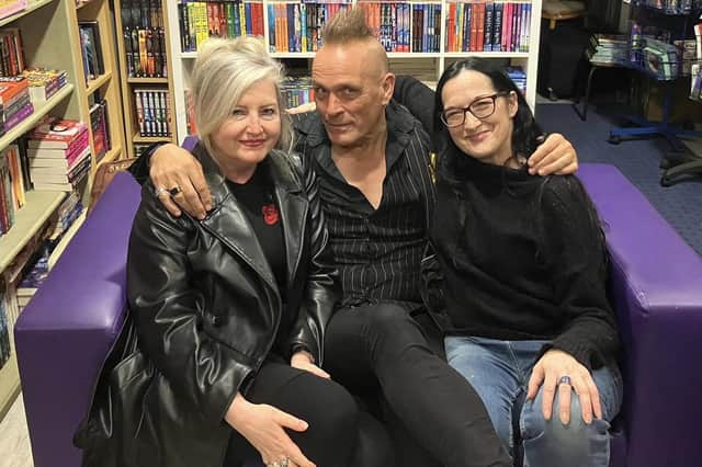 John Robb meets fans during his visit to Little Acorns, including bookstore owner Jenni Doherty, on right.