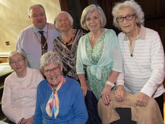 Deputy Mayor Darren Guy pictured with a group of ladies enjoying the Mayor's Tea Dance on Wednesday.