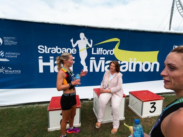 Mayor of Derry City and Strabane District Council, Councillor Patricia Logue chats to a competitor at the finishing line on Sunday. (Photo: Karol McGonigle)