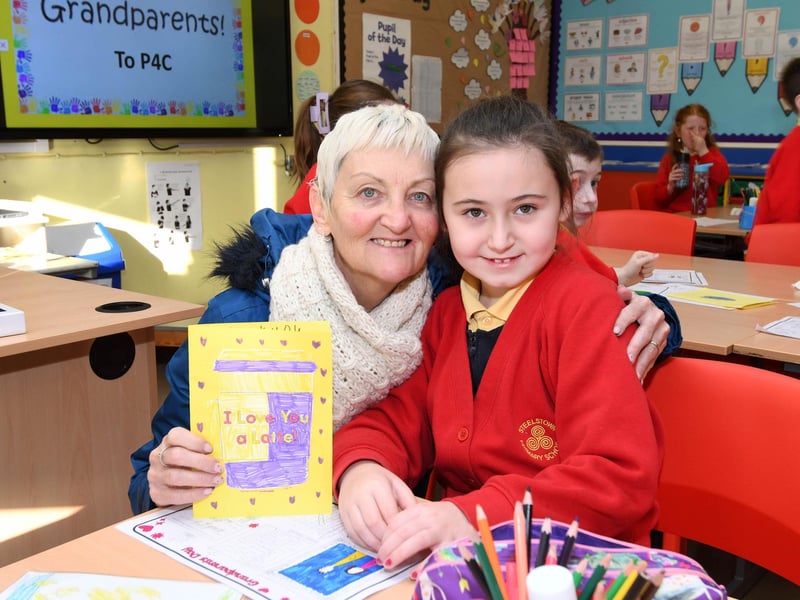Mia and her granny pose for a picture at Steelstown PS 'Grandparents to School Day.