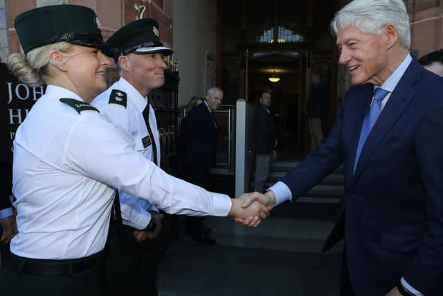 Nigel Goddard and a police colleague meeting former US President Bill Clinton.