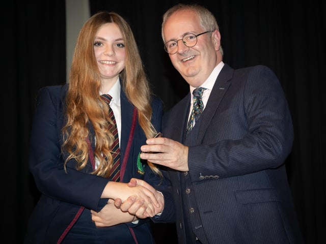 Emily McLucas, receiving the Athletics Award from Principal Mr. John Harkin on Thursday night. She received Full Attendance Award, and the Commitment Award for Food and Nutrition.