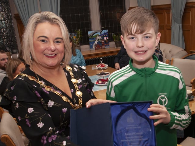 The Mayor of Derry City and Strabane District Council, Sandra Duffy making a special presentation to Strabane teenager Lucas O’Connell to mark his recent victory in the WUKF 12 Years Individual Boys Komite European Championship at a reception in his honour at the Guildhall on Tuesday evening last. (Photos: Jim McCafferty Photography)