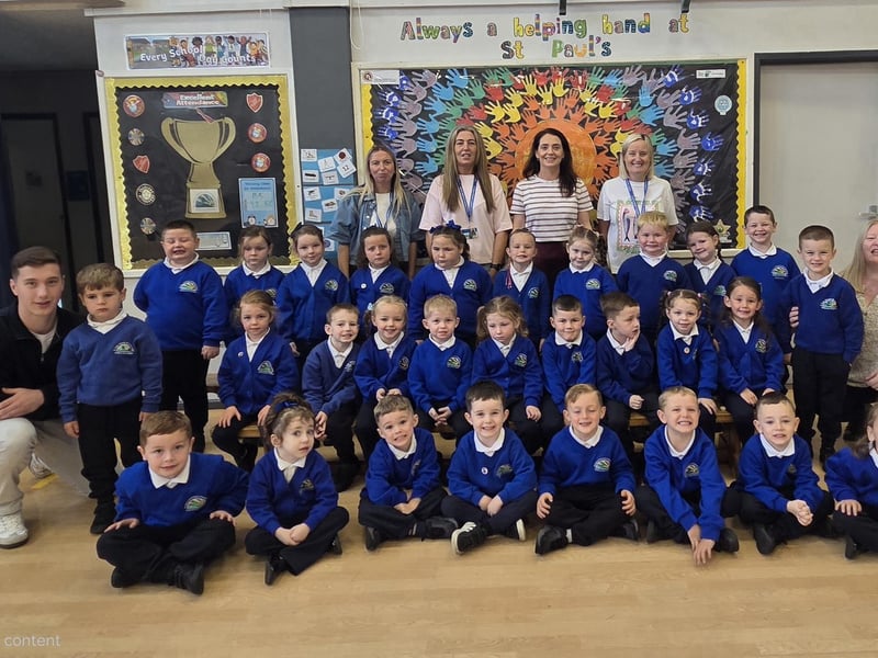 Mrs Logue's P1 class, St Paul's Primary School, with teaching assistants Mr Clifford, Miss Johnston, Mrs Carlin, Mrs Green and Mrs Lynch.