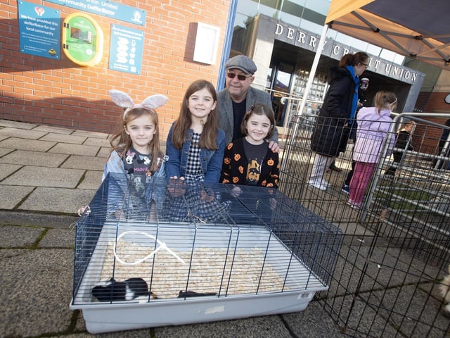 Grandad Pat McIntyre with granddaughters Farah (8), Elena (7) and Isla (5) at Saturday's International Credit Union Day celebrations. : .