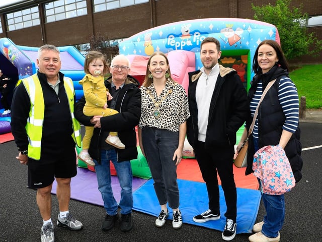 Mayor Grace Uí Niallais with from left, Sean Carlin, GSAP, Frank O’Kane, granddaughter Daisy, and from right, Marisa McDonnell, GSAP, and David Keenan, NI Housing Executive, at the St Brigid’s Heart of Community Festival on Saturday. (Photo - Tom Heaney, nwpresspics)