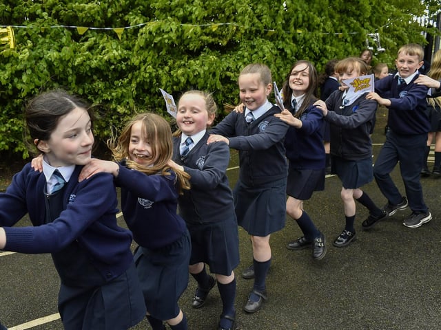 Happy pupils from Rosemount Primary School enjoy the entertainment from the Jive Aces on Thursday morning. Photo: George Sweeney
