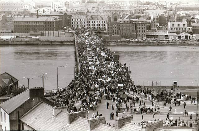 Crowds gather from across Derry and the north at a Rally for Peace on Craigavon Bridge.