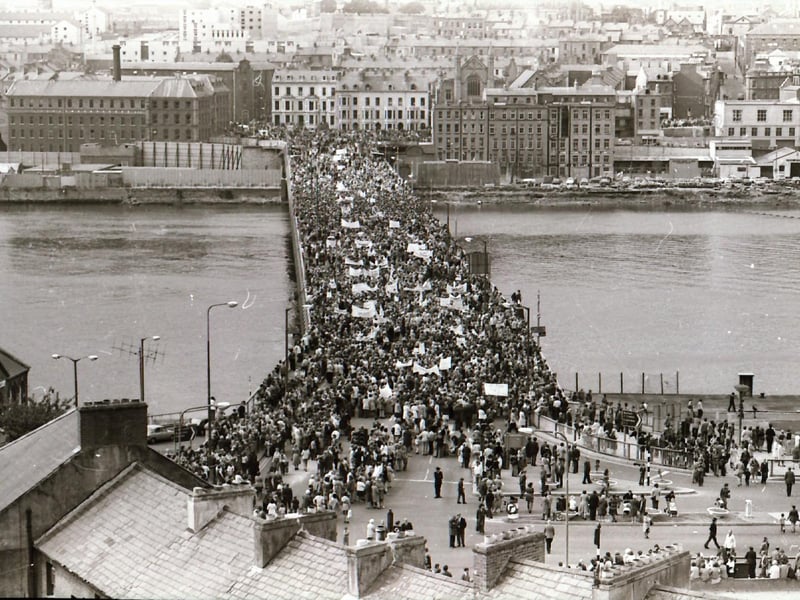 Crowds gather from across Derry and the north at a Rally for Peace on Craigavon Bridge.