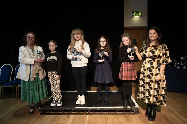 MacCafferty School of Music director Una O’Somachain and Blathnaid Biddle, adjudicator pictured with the junior group, Elsa Kehoe, Caoimhe Doherty, Georgia Mahon and Holly Gormley at last week's Charity Feis..