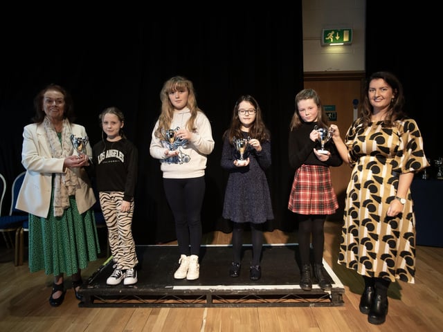 MacCafferty School of Music director Una O’Somachain and Blathnaid Biddle, adjudicator pictured with the junior group, Elsa Kehoe, Caoimhe Doherty, Georgia Mahon and Holly Gormley at last week's Charity Feis..