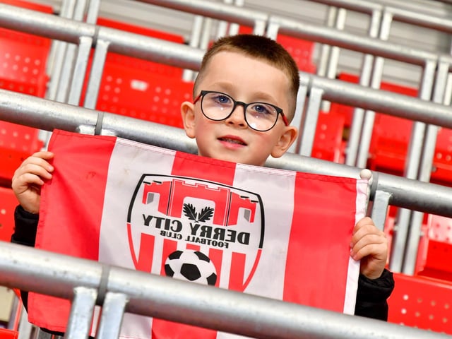This young fan proudly flies the Derry City colours.