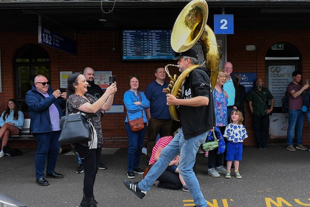 The Jaydee Brass Band’s Patrick Witberg entertaining passengers at the Foyle Street Bus station. Photo: George Sweeney