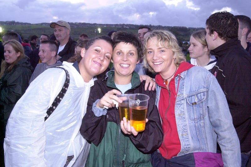Fans enjoying the Oasis and Ocean Colour Scene concert in September 2002.