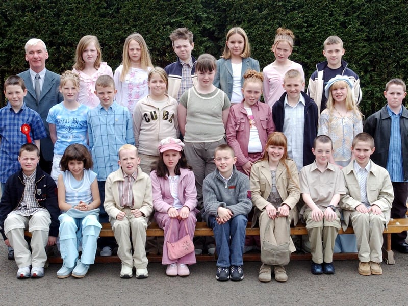 Pupils from St Paul's Primary School, Slievemore, who were confirmed in St. Joseph's Church, Galliagh, by Most Rev. Dr. Seamus Hegarty, Bishop of Derry.  Included is class teacher Mr Brian O'Donnell.