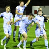 Derry CIty's Ronan Boyce, Joe Thomson, Cian Kavanagh and Ryan Graydon celebrate in front of the travelling fans.