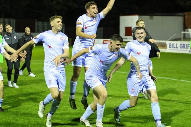 Derry CIty's Ronan Boyce, Joe Thomson, Cian Kavanagh and Ryan Graydon celebrate in front of the travelling fans.