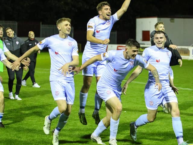 Derry CIty's Ronan Boyce, Joe Thomson, Cian Kavanagh and Ryan Graydon celebrate in front of the travelling fans.