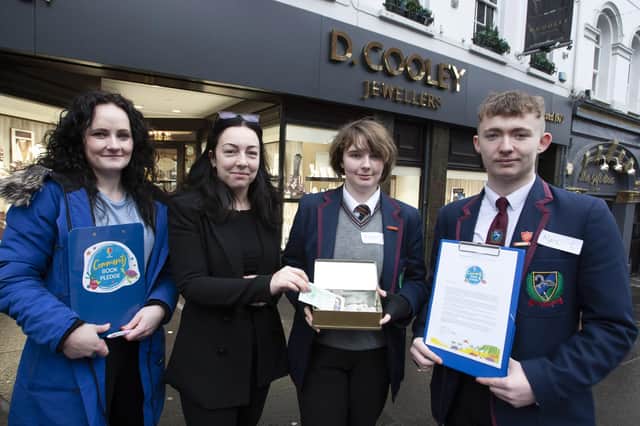 Erin Kearney from Danny Cooley Jewellers making a donation to Oakgrove’s Book Pledge on Friday morning.