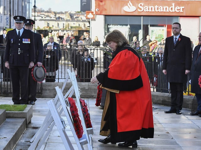 The Deputy Mayor of Derry and Strabane, Alderman Niree McMorris, places a wreath at the Cenotaph in the Diamond during the Royal British Legion Waterside Remembrance Sunday service. Photo: George Sweeney