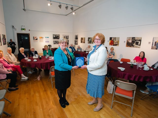 Derry City & Strabane District Council Deputy Mayor Angela Dobbins pictured making a presentation to Joan Beattie, WI Area Executive for Abercorn marking 90 years of the group at a special reception in The Alley Theatre. 