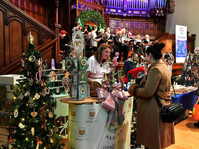 Browsing the large range of gifts availableat the Guildhall Christmas Fair. Photo: George Sweeney / Derry Journal