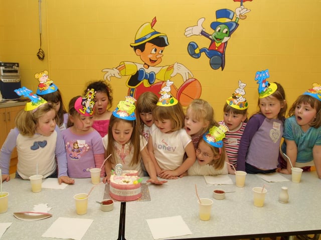 Chloe blows out her candles with some help from her friends
