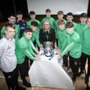 Members of the St. Joseph's u-18 NI Cup winning team pictured with Principal, Ciara Deane, coaches Emmett McGinty and Conor Lynch and Derry City stars and former St. Joseph's students, Ciaran Harkin and Glenn McCourt on Thursday morning at the school. (Photos: Jim McCafferty Photography)