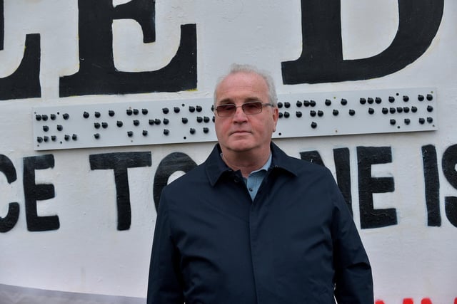 Richard Moore from Children in Crossfire unveiled a Braille sign on Free Derry Corner on Tuesday afternoon. Photo: George Sweeney. DER2305GS – 66