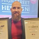 Bryan McCandless, Cityman Menswear, pictured with their two awards.