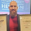 Bryan McCandless, Cityman Menswear, pictured with their two awards.