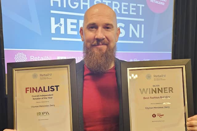 Bryan McCandless, Cityman Menswear, pictured with their two awards.