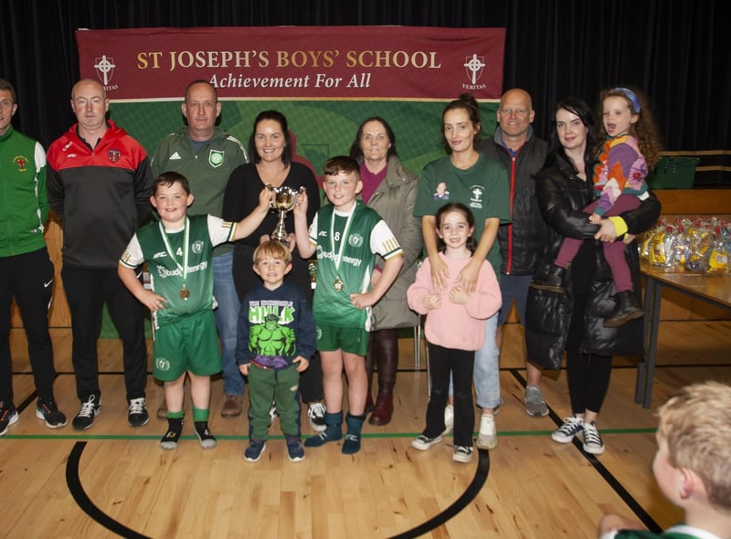 Foyle Harps joint captains ,Jake Mooney and Joe Gray receiving the 2012 trophy on Sunday at St. Joseh’s Boys School. Included are members of the O’Kane family, and tournament organisers, Emmett McGinty, Christy McGeehan and Paul Gibbons. (Photos: Jim McCafferty Photography)