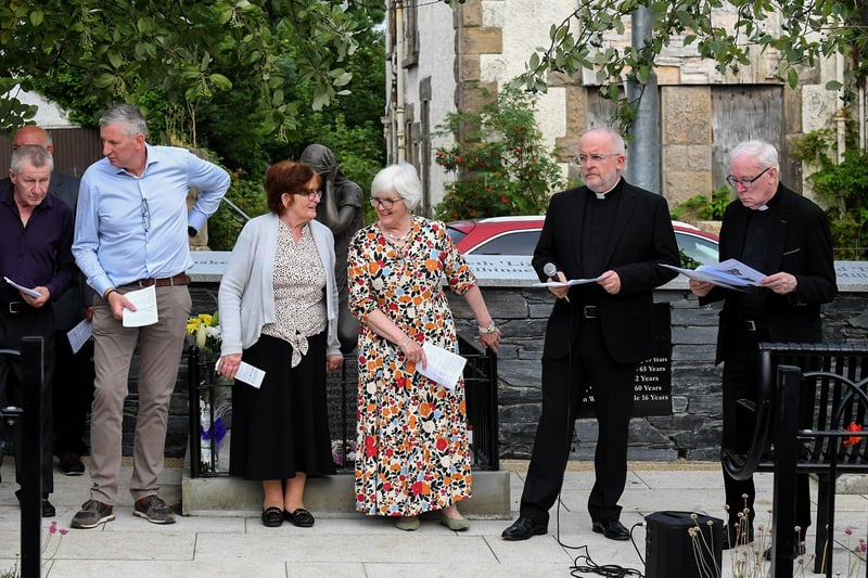The Rev. David Slater, Church of Ireland, and Fr. David O’Kane, PP, VF, with relatives of those killed and injured in the Claudy car bombing on 31 July 1972 at the unveiling of the newly-refurbished memorial on Wednesday evening. Photo: George Sweeney