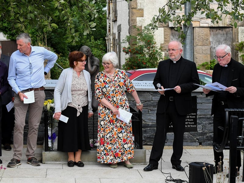 The Rev. David Slater, Church of Ireland, and Fr. David O’Kane, PP, VF, with relatives of those killed and injured in the Claudy car bombing on 31 July 1972 at the unveiling of the newly-refurbished memorial on Wednesday evening. Photo: George Sweeney