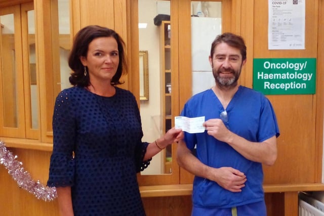 Majella, representing the Grant Family of Magherabeg, Burnfoot, presenting a cheque for €2687.46 to Rory representing the Patient's Comfort Fund, the Oncology Ward, Letterkenny University Hospital. The donations were collected in lieu of flowers at Mary Grant's Funeral. The Grant family would like to thank everyone for their generosity.