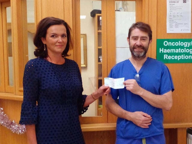 Majella, representing the Grant Family of Magherabeg, Burnfoot, presenting a cheque for €2687.46 to Rory representing the Patient's Comfort Fund, the Oncology Ward, Letterkenny University Hospital. The donations were collected in lieu of flowers at Mary Grant's Funeral. The Grant family would like to thank everyone for their generosity.